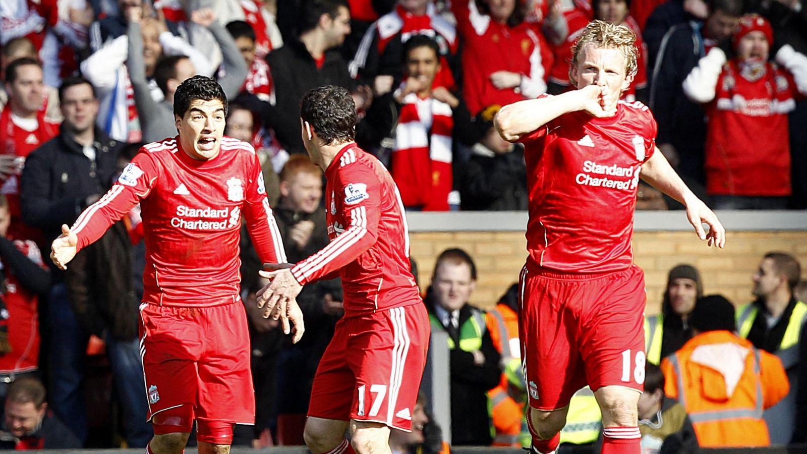 Liverpool's Dirk Kuyt celebrates scoring scoring with Luis Suarez and Rodriguez Maxi in the Premier League game against Manchester United at Anfield, Liverpool. 6 March 2011.