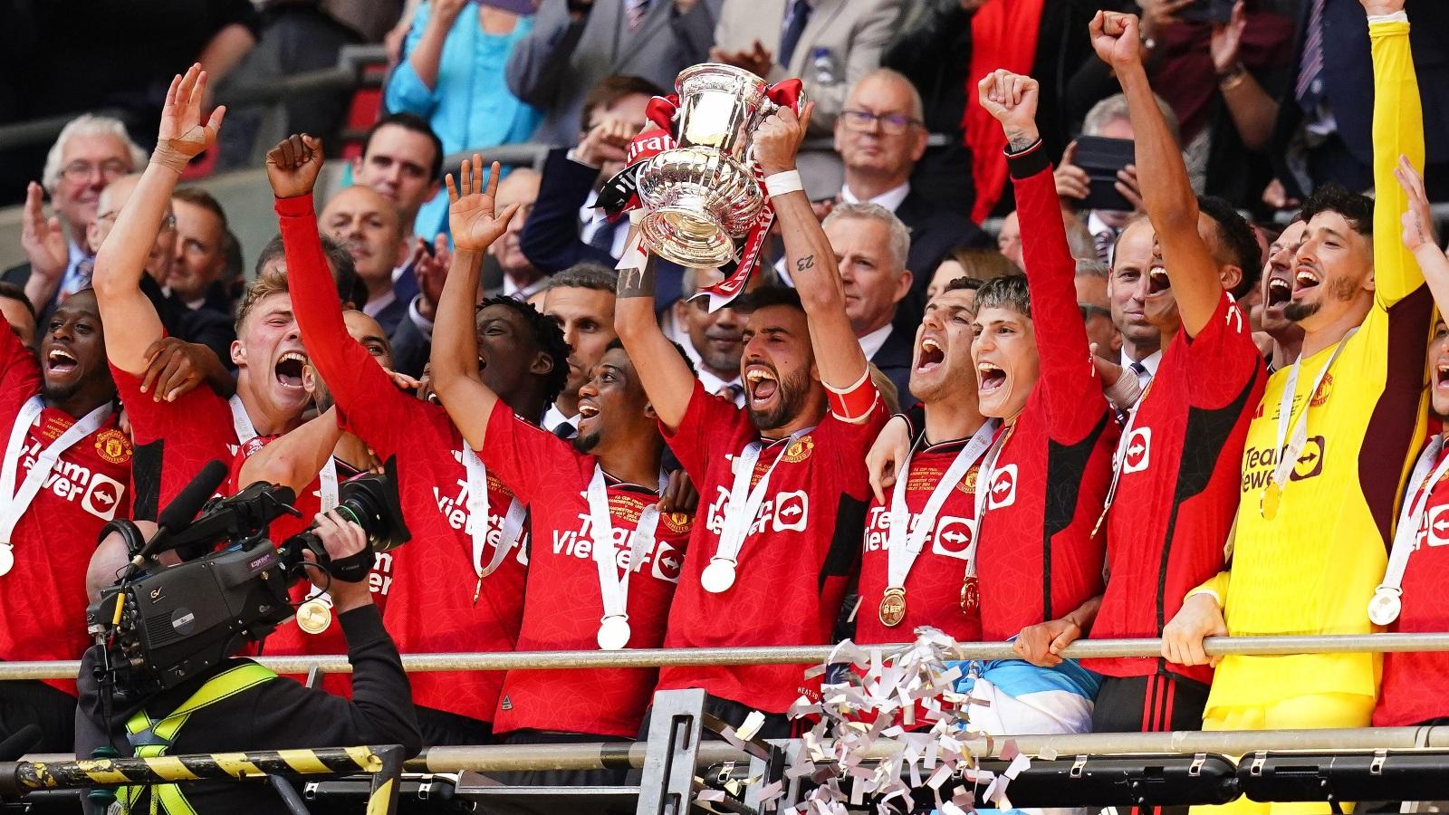 Manchester United's Bruno Fernandes lifts the FA Cup Trophy after winning the Emirates FA Cup final at Wembley Stadium, London. Picture date: Saturday May 25, 2024.