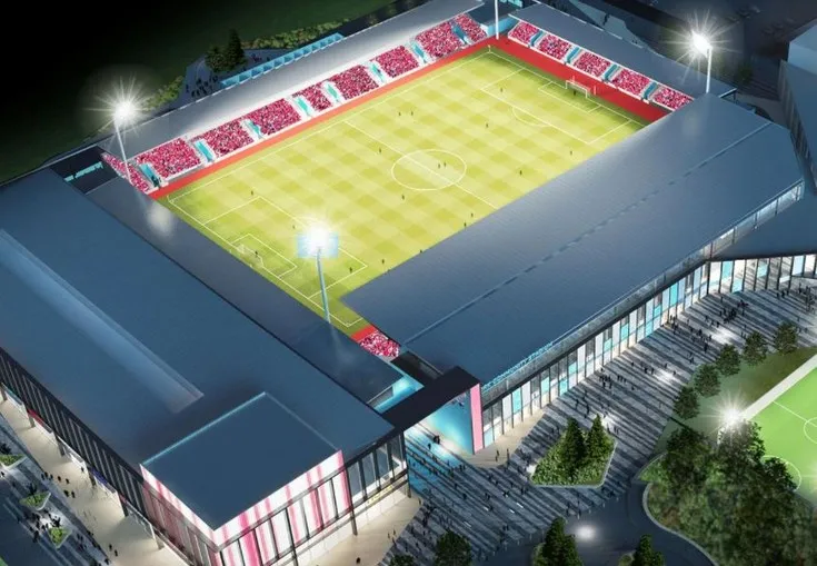 Hình ảnh sân LNER Stadium vào ban đêm với thiết kế ánh sáng hiện đại